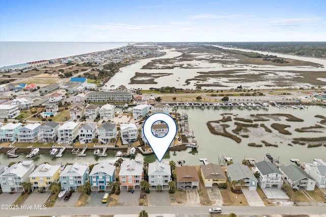 bird's eye view featuring a water view and a residential view