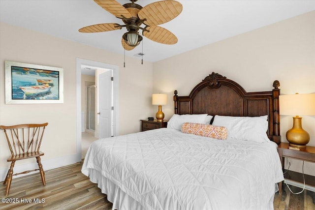 bedroom featuring ceiling fan, baseboards, and wood finished floors