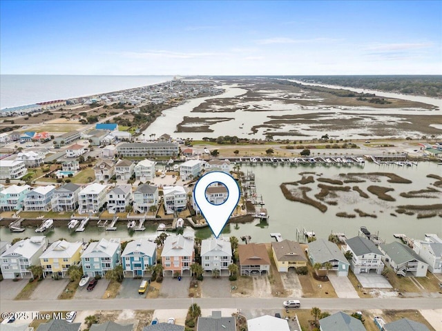 birds eye view of property featuring a water view and a residential view