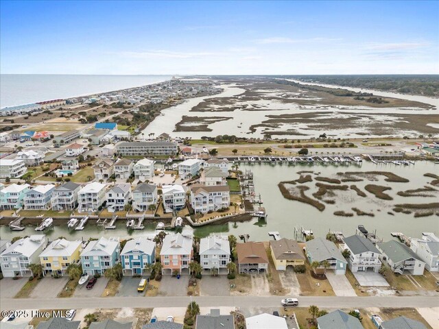 bird's eye view featuring a water view and a residential view