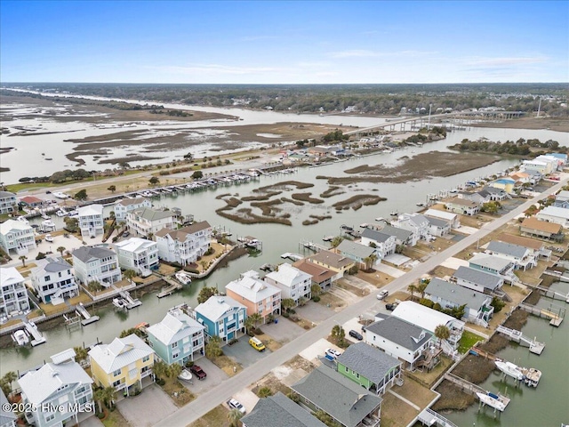 birds eye view of property featuring a water view and a residential view