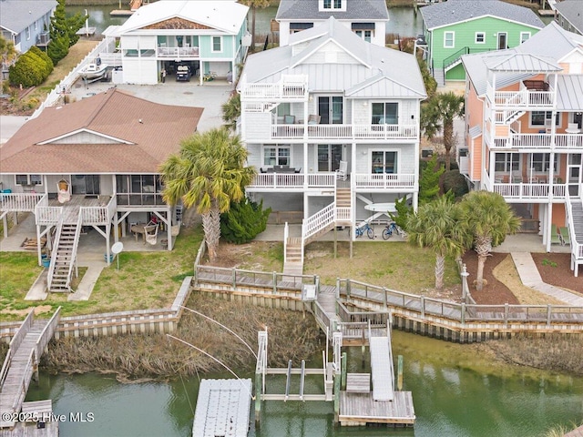 drone / aerial view with a residential view and a water view