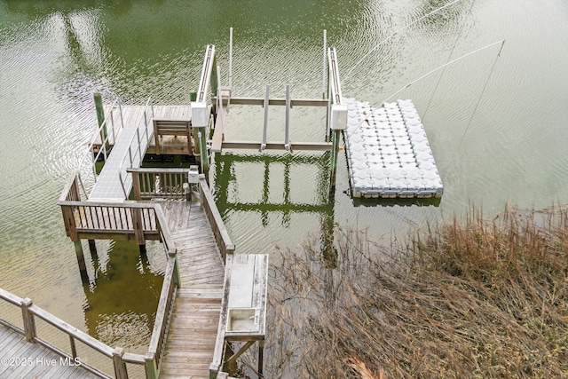 view of dock with a water view and boat lift