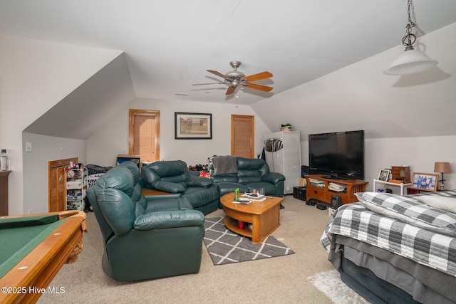 living room with carpet, vaulted ceiling, and a ceiling fan