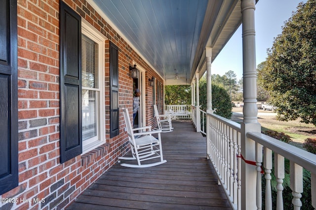 wooden terrace featuring a porch