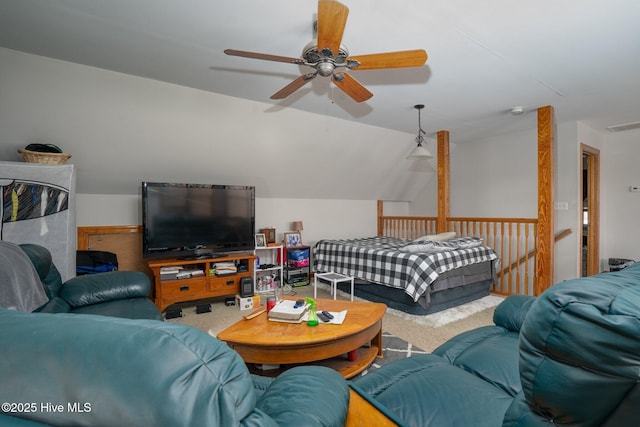 carpeted living area with visible vents and vaulted ceiling