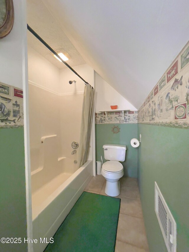 carpeted empty room with ceiling fan, visible vents, and a textured ceiling