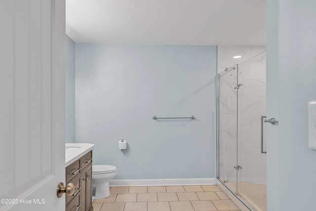 full bath with baseboards, toilet, a shower stall, and vanity