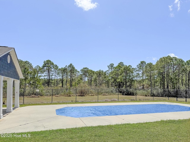 view of swimming pool with fence, a fenced in pool, and a yard