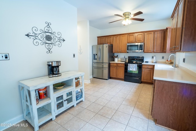 kitchen with ceiling fan, stainless steel appliances, light countertops, open shelves, and a sink