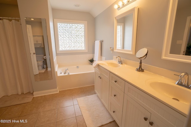 full bathroom featuring a healthy amount of sunlight, a sink, and tile patterned floors