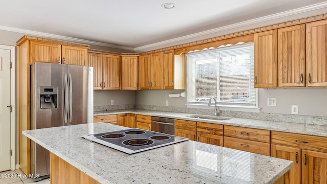 kitchen with stainless steel appliances, a sink, a center island, light stone countertops, and crown molding