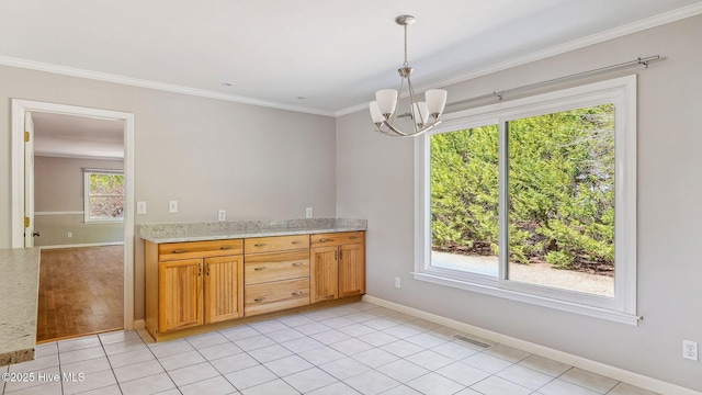 kitchen with pendant lighting, light tile patterned floors, visible vents, ornamental molding, and a chandelier