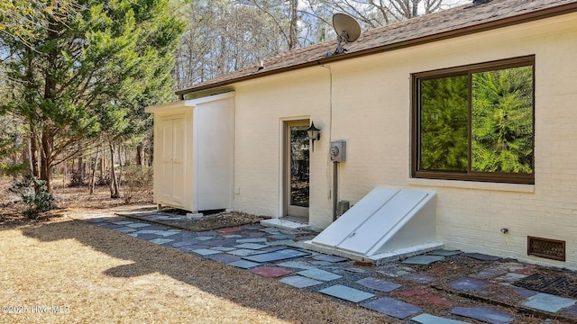 exterior space featuring brick siding