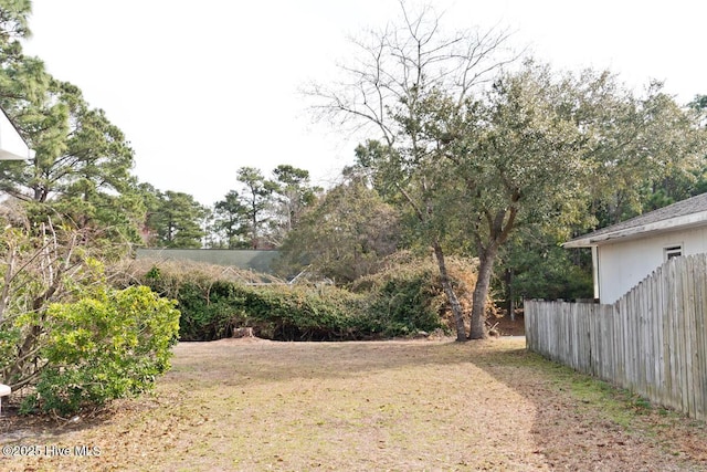 view of yard featuring fence