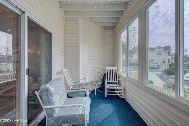 sunroom with beamed ceiling