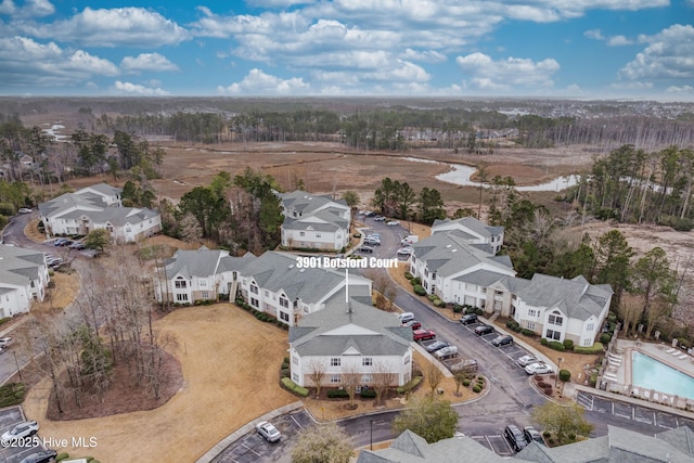 birds eye view of property with a residential view