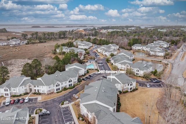 birds eye view of property with a residential view