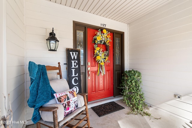 entrance to property featuring a porch