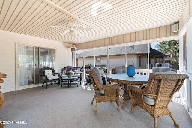 view of patio with outdoor dining space and ceiling fan