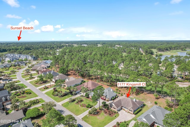 aerial view featuring a residential view, a water view, and a forest view