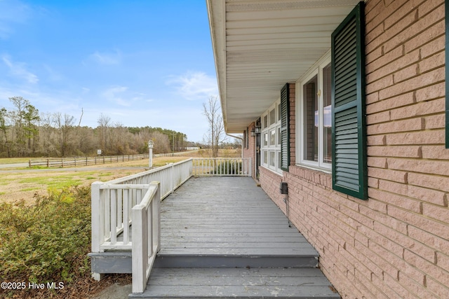 wooden terrace featuring covered porch