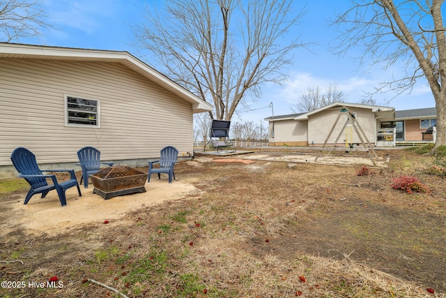 view of yard with a fire pit