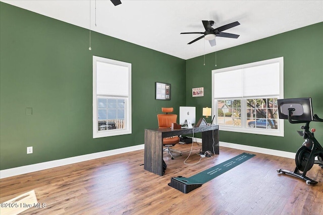 office featuring baseboards, wood finished floors, and a ceiling fan