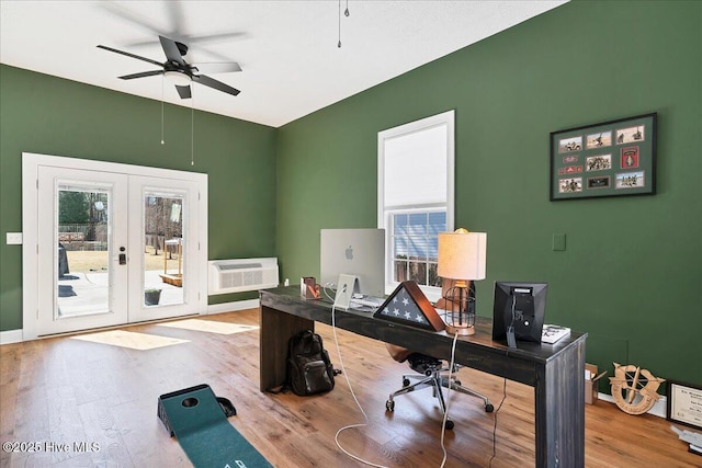 home office with wood finished floors, french doors, a wealth of natural light, and ceiling fan