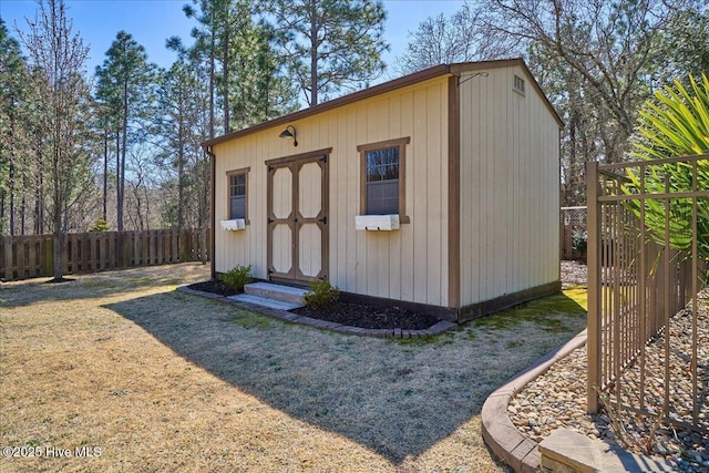 view of shed featuring a fenced backyard