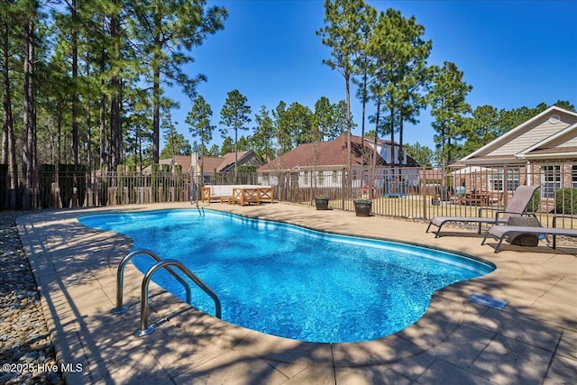 view of pool with a fenced in pool, a patio, and fence