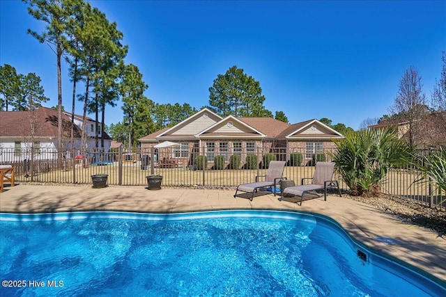 view of pool featuring a fenced in pool, a patio area, and fence