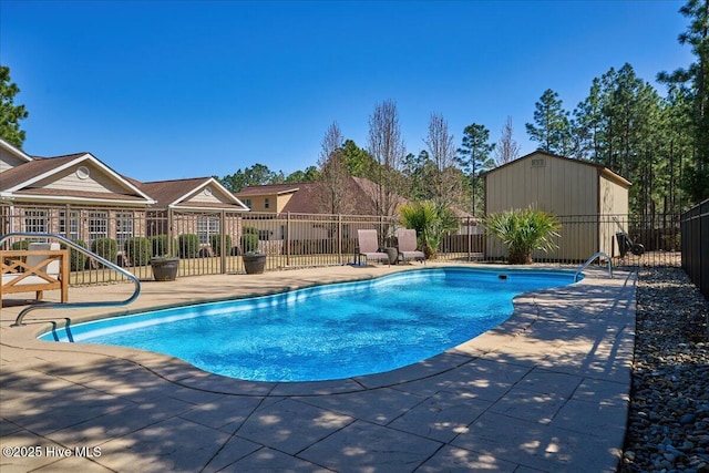 view of pool featuring a fenced in pool, an outdoor structure, a patio, and fence