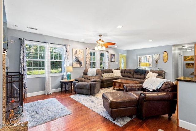 living room featuring baseboards, visible vents, a ceiling fan, hardwood / wood-style floors, and recessed lighting