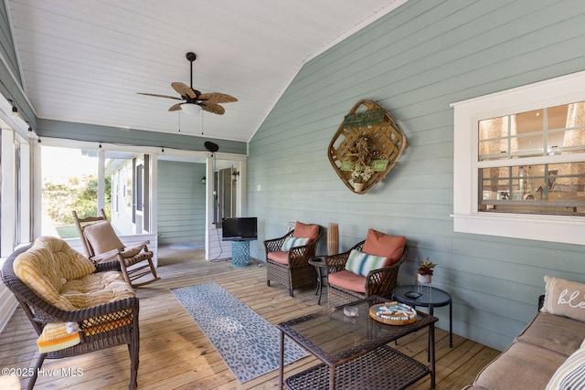 sunroom / solarium featuring ceiling fan and vaulted ceiling