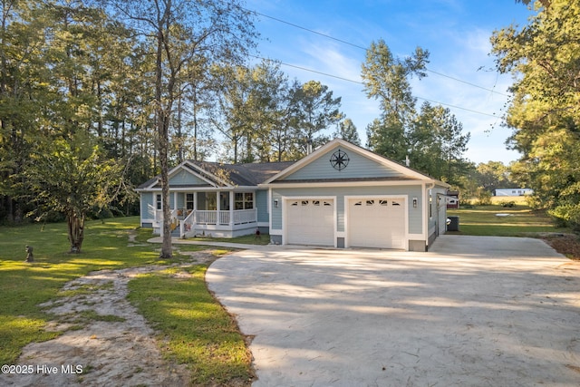 view of front of property featuring an attached garage, covered porch, concrete driveway, and a front yard