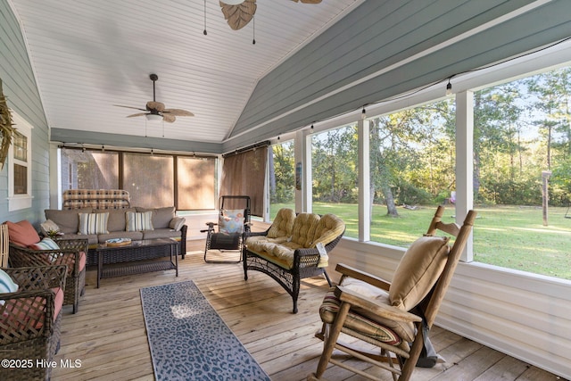 sunroom / solarium with lofted ceiling and ceiling fan