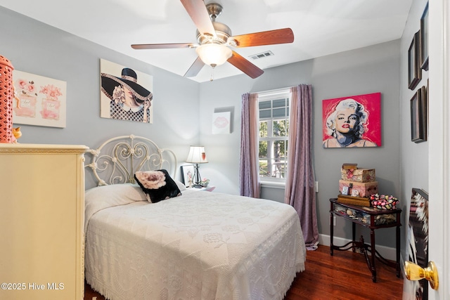 bedroom featuring ceiling fan, visible vents, baseboards, and dark wood-type flooring