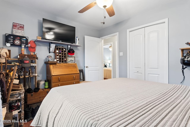 bedroom with ceiling fan and a closet