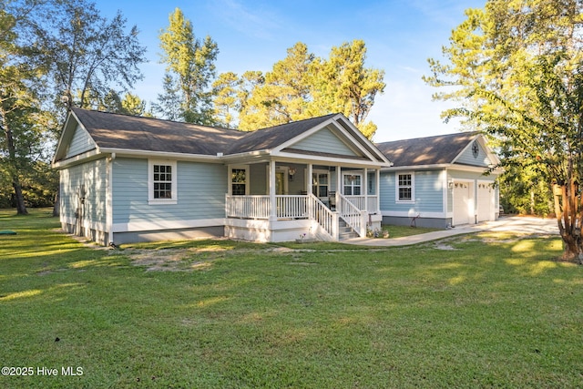 view of front of property featuring a garage, covered porch, and a front lawn