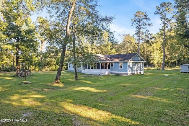 view of yard with a sunroom