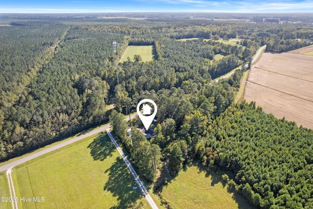 drone / aerial view featuring a view of trees