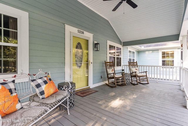 wooden deck featuring ceiling fan and a porch