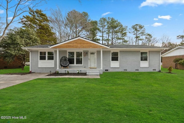 ranch-style home with crawl space, driveway, a front lawn, and brick siding