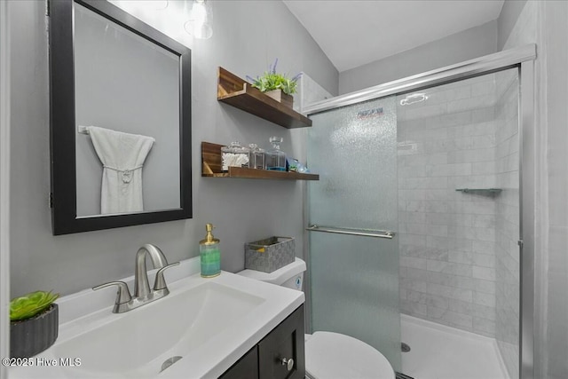 full bath with toilet, a stall shower, and vanity