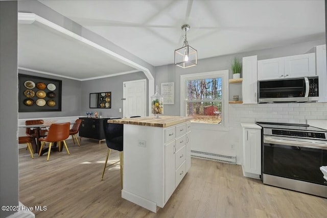 kitchen with open shelves, stainless steel appliances, light wood-style flooring, white cabinetry, and wood counters