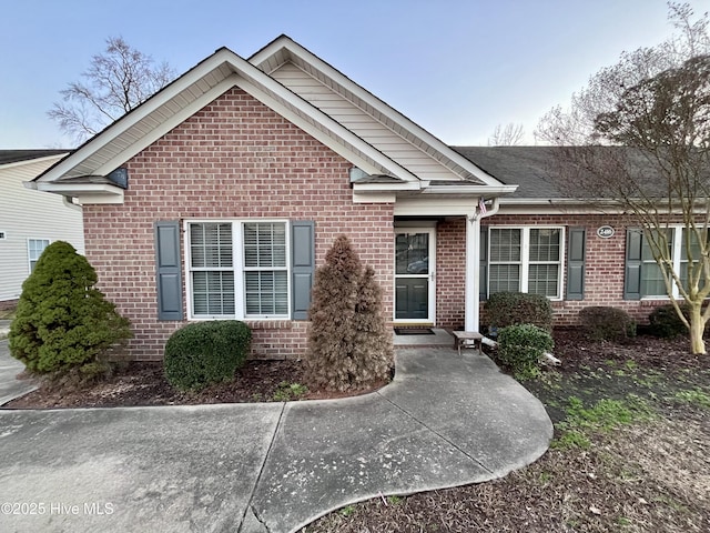 view of front of home with brick siding