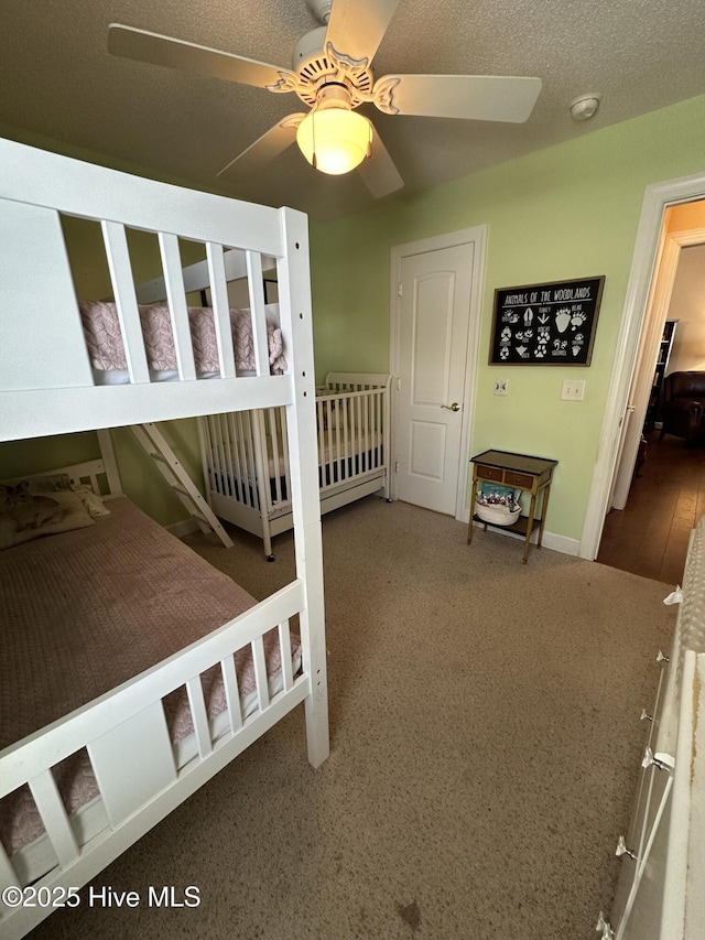 unfurnished bedroom with a textured ceiling and a ceiling fan