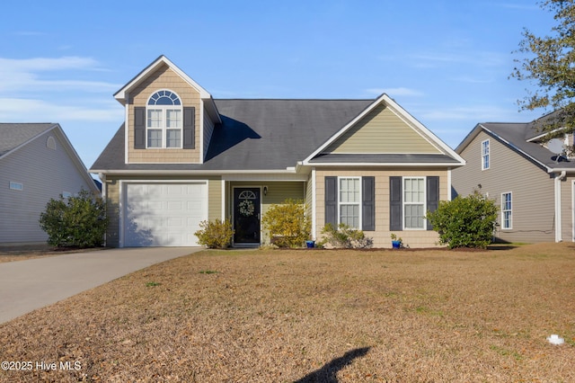 view of front of home featuring a front lawn and concrete driveway