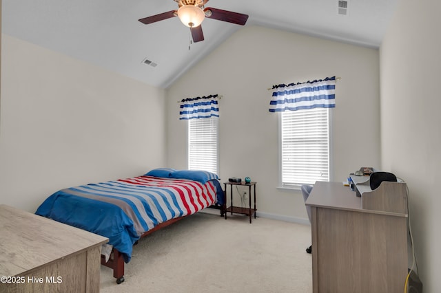 bedroom with light carpet, visible vents, vaulted ceiling, and a ceiling fan